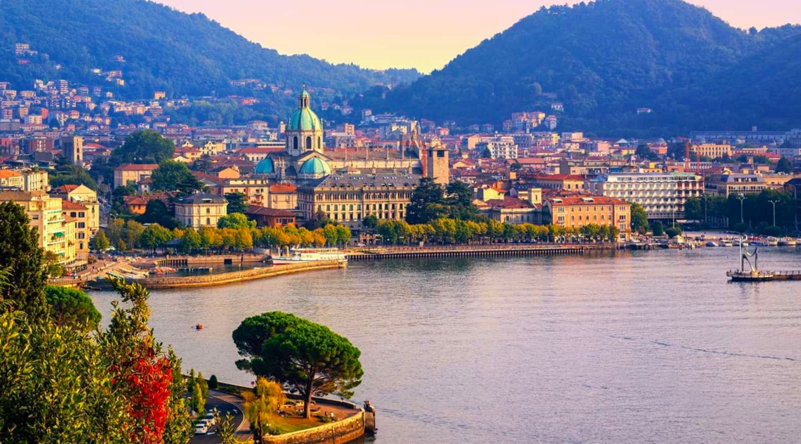 Como city waterfront with its cathedral at dusk, the arrival point of a day trip from Milan