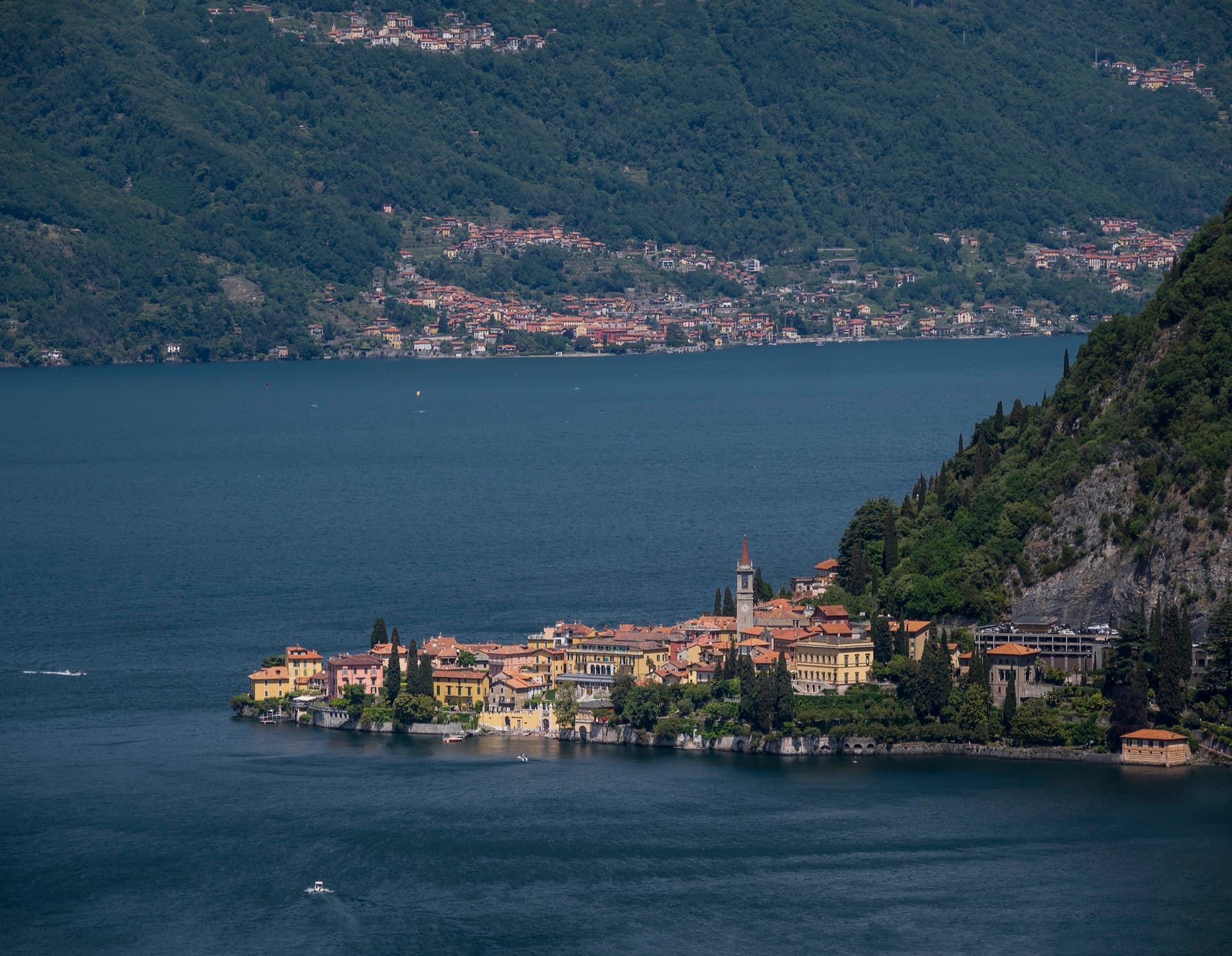 The village of Varenna on its headland seen from above, with the deep blue water of Lake Como all around