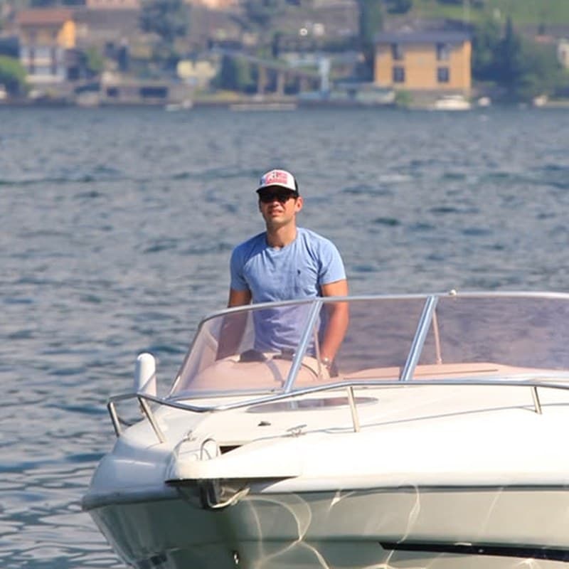 Paolo at the helm of his Cranchi on Lake Como